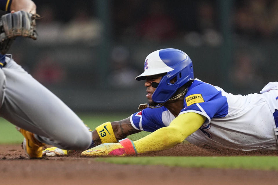 Atlanta Braves' Ronald Acuna Jr. steals second base during the first inning of the team's baseball game against the Milwaukee Brewers on Saturday, July 29, 2023, in Atlanta. (AP Photo/John Bazemore)
