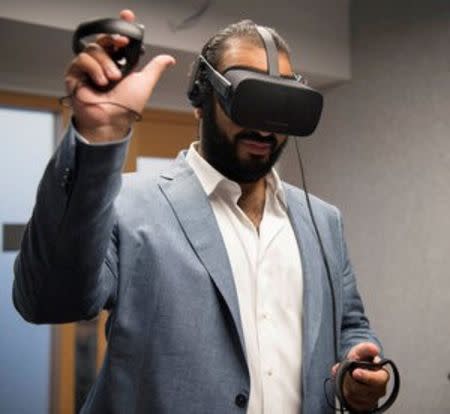 Saudi Arabia's Deputy Crown Prince Mohammed bin Salman tests a technology in Silicon Valley, U.S. June 22, 2016. Saudi Royal Court/Handout via REUTERS