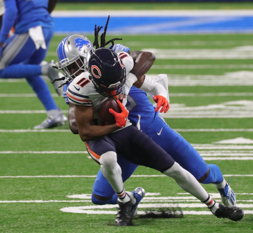 Detroit Lions cornerback Desmond Trufant (23) tackles Chicago Bears wide receiver Darnell Mooney (11) during third quarter action at Ford Field Sunday, September 13, 2020. 