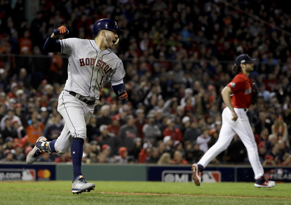 Houston Astros’ Carlos Correa celebrates after his RBI-single against the Boston Red Sox during the sixth inning in Game 1 of a baseball American League Championship Series on Saturday, Oct. 13, 2018, in Boston. (AP)