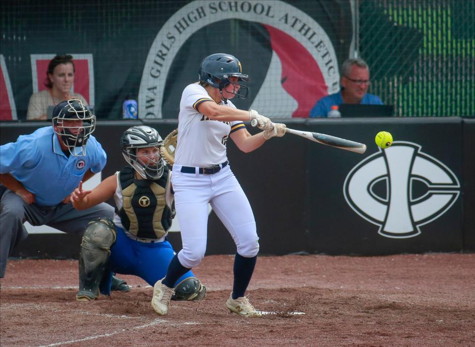 Iowa City Regina junior Dani Laughlin connects on a pitch against Van Meter on Tuesday during the Iowa high school girls state softball tournament in Fort Dodge.