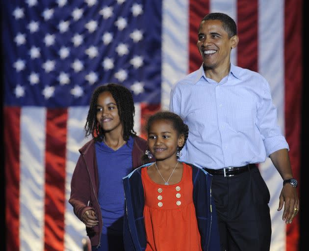 Obama and his daughters Sasha at a rally at JFK Stadium in Springfield, Missouri, Nov. 1, 2008.  (Photo: EMMANUEL DUNAND via Getty Images)