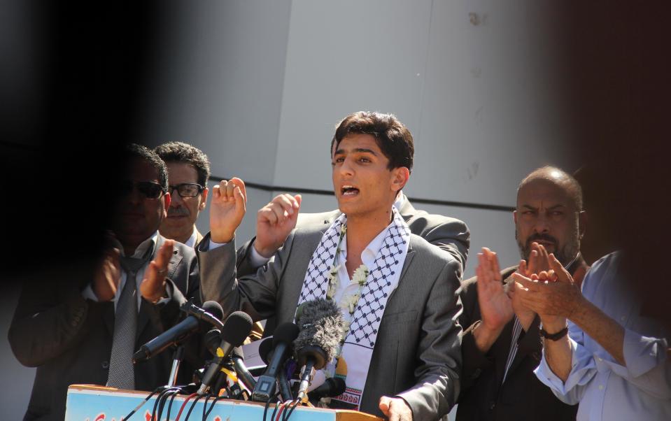 Arab Idol winner Palestinian Mohammed Assaf, speaks on arrival at the Rafah crossing point on the border between Egypt and southern Gaza Strip, Tuesday, June 25, 2013. Huge crowds of Gazans gave a gleeful welcome Tuesday to the first Palestinian winner of the Arab Idol talent contest, thronging the territory's border crossing with Egypt and the singer's home in hopes of embracing him, but internal politics surfaced quickly. Assaf’s victory in the popular contest Saturday sparked huge celebrations in the West Bank and Gaza, giving Palestinians a sense of pride. (AP Photo/Khaled Omar, Pool)