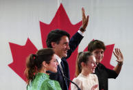 Prime Minister Justin Trudeau is joined on stage by wife Sophie Gregoire Trudeau, left, and children Xavier and Ella-Grace, during his victory speech at Party campaign headquarters in Montreal, early Tuesday, Sept. 21, 2021. (Sean Kilpatrick/The Canadian Press via AP)