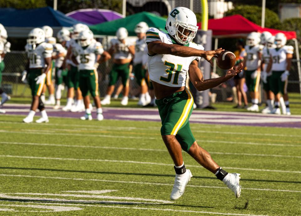 Belhaven Blazers wide receiver Reginald Garrison (31) catches a football during pre-game warm ups at Harper Davis Field in Jackson, Miss., on Sep. 1, 2022. 