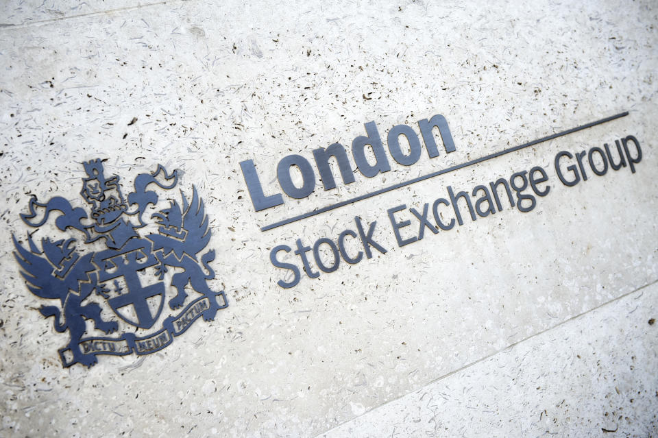 "London, UK - April 15, 2012: London Stock Exchange Group sign shines golden on neutral stone wall. The group owns the London Stock Exchange as well as the Borsa Italiana."