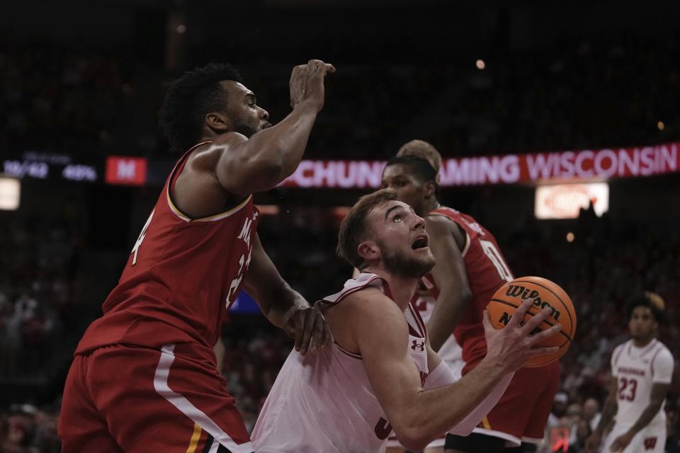 Maryland's Donta Scott fouls Wisconsin's Tyler Wahl during the second half of an NCAA college basketball game Tuesday, Feb. 20, 2024, in Madison, Wis. (AP Photo/Morry Gash)