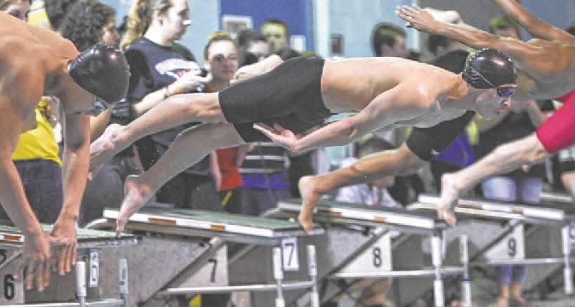 Joe Baron of St. Joseph in Metuchen leaps off the starting block as he swims the 50-yard freestyle in the GMC Championships on Friday, Jan. 31, 2014.