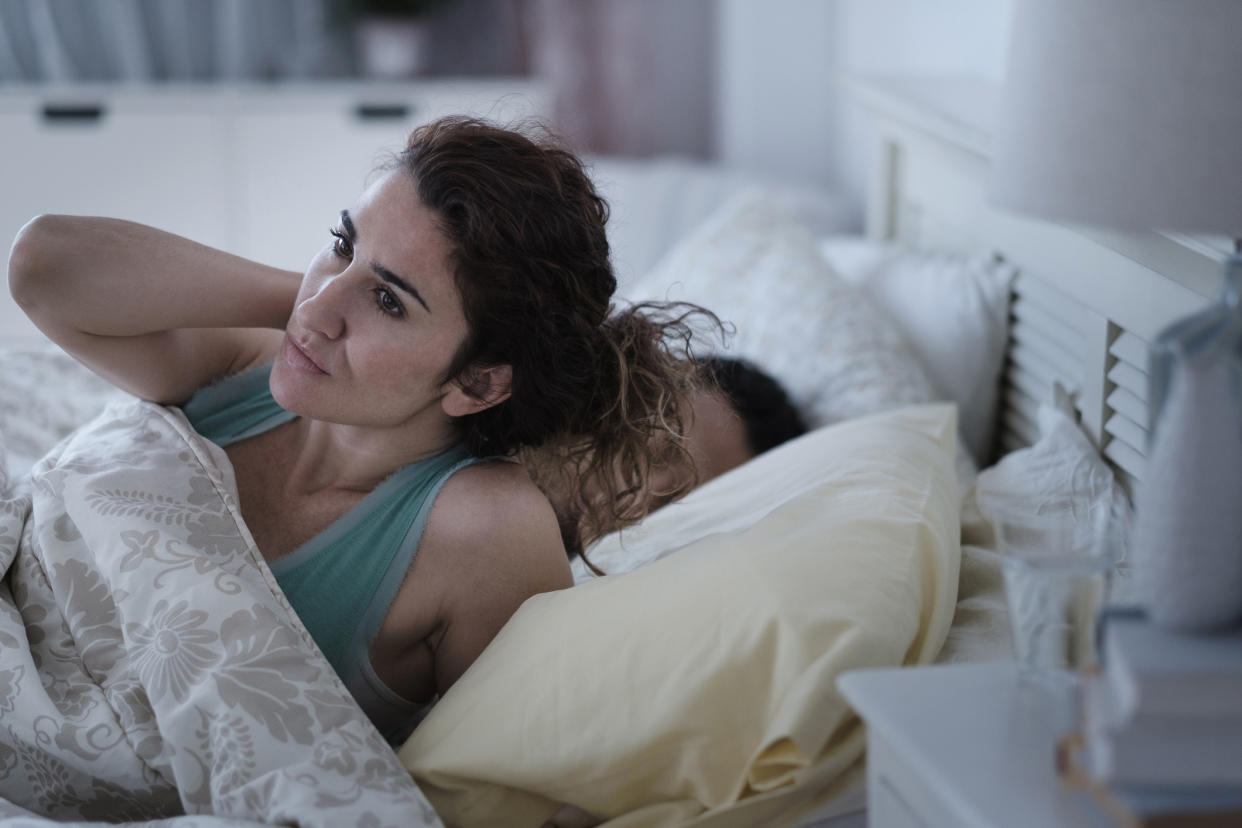 Waking up from a dream about your partner cheating on you. (Getty Images)