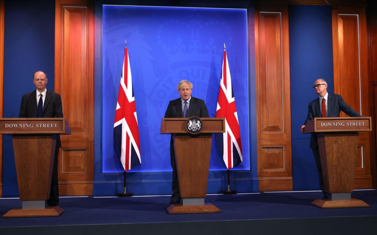 Boris Johnson with Sir Patrick Vallance (R) and Chris Whitty (L) - Getty