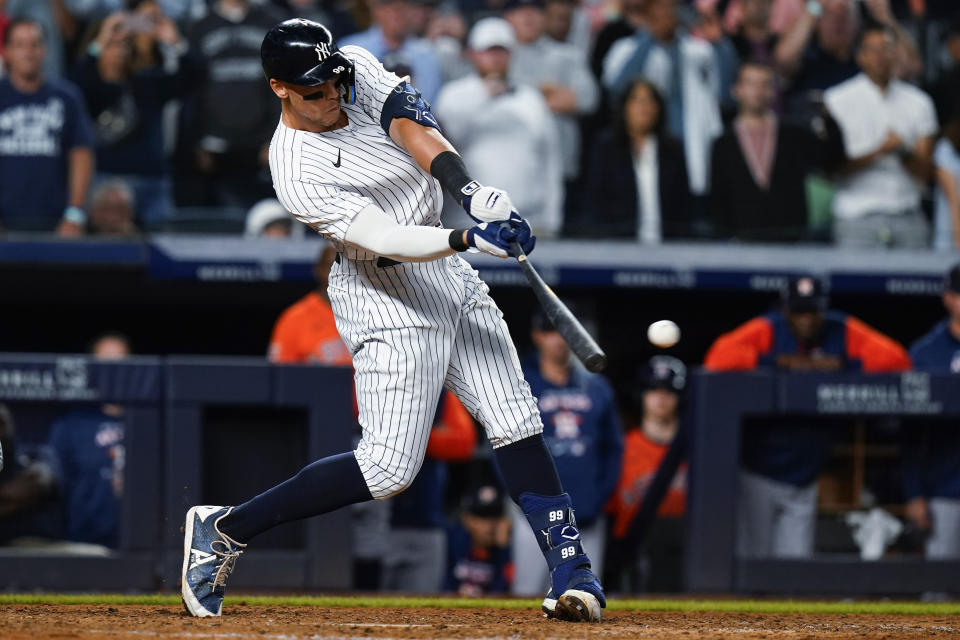 New York Yankees' Aaron Judge hits a single to drive in the winning run during the ninth inning of the team's baseball game against the Houston Astros on Thursday, June 23, 2022, in New York. The Yankees won 7-6. (AP Photo/Frank Franklin II)