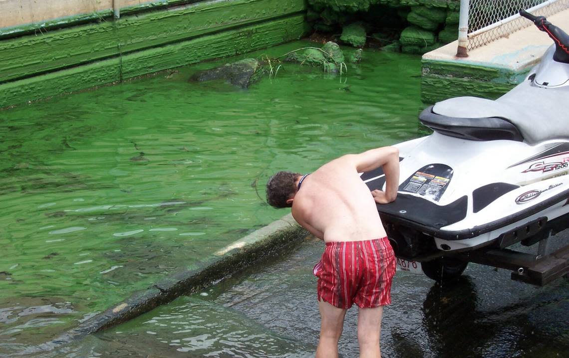 A jet skier braves a 2005 algae bloom in Jacksonville.