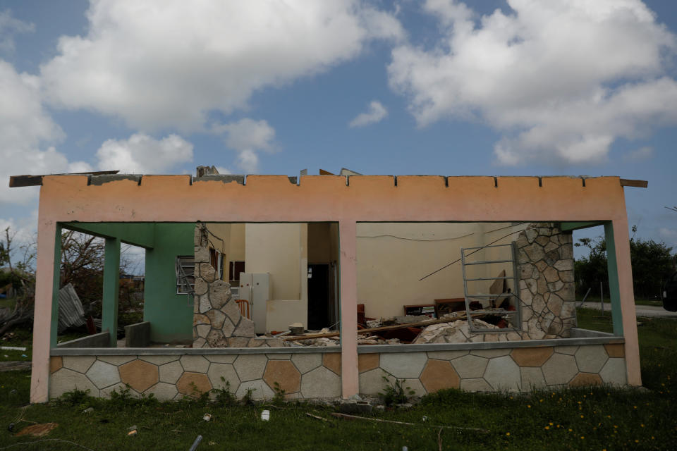 A home is seen in ruins at Codrington on the island of Barbuda just after a month after Hurricane Irma struck the Caribbean islands of Antigua and Barbuda