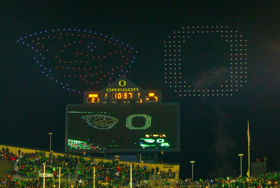 A special drone show plays above the west scoreboard at Autzen Stadium during halftime of the Oregon and Oregon State game Friday, Nov. 24, 2023.