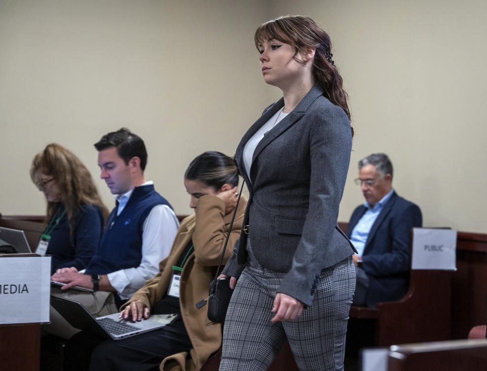 CORRECTS SOURCE TO ALBUQUERQUE JOURNAL INSTEAD OF SANTA FE NEW MEXICAN - Hannah Gutierrez-Reed walks into court for the first day of testimony in her trial in Santa Fe, N.M., Thursday, Feb. 22, 2024. Gutierrez-Reed was working as the armorer on the movie "Rust," when actor Alec Baldwin fired a gun during rehearsal, killing cinematographer Halyna Hutchins and wounding the film’s director, Joel Souza. Gutierrez-Reed is charged with involuntary manslaughter and tampering with evidence. (Eddie Moore/The Albuquerque Journal via AP, Pool)