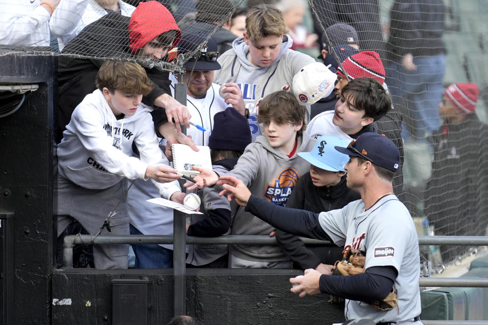 Detroit Tigers' Colt Keith signs autographs after the team's 1-0 shutout of the Chicago White Sox in the White Sox's home opener baseball game Thursday, March 28, 2024, in Chicago. (AP Photo/Charles Rex Arbogast)