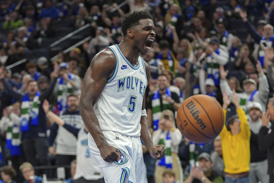 Minnesota Timberwolves guard Anthony Edwards (5) celebrates after a dunk against the Brooklyn Nets during the second half of an NBA basketball game Saturday, Feb. 24, 2024, in Minneapolis. (AP Photo/Abbie Parr)