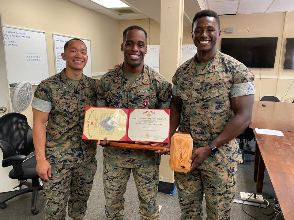 Marine Capt. Shak Robinson (middle), Olmstead Scholar. He enjoyed an earlier, international-focused sabbatical in Central and South America.