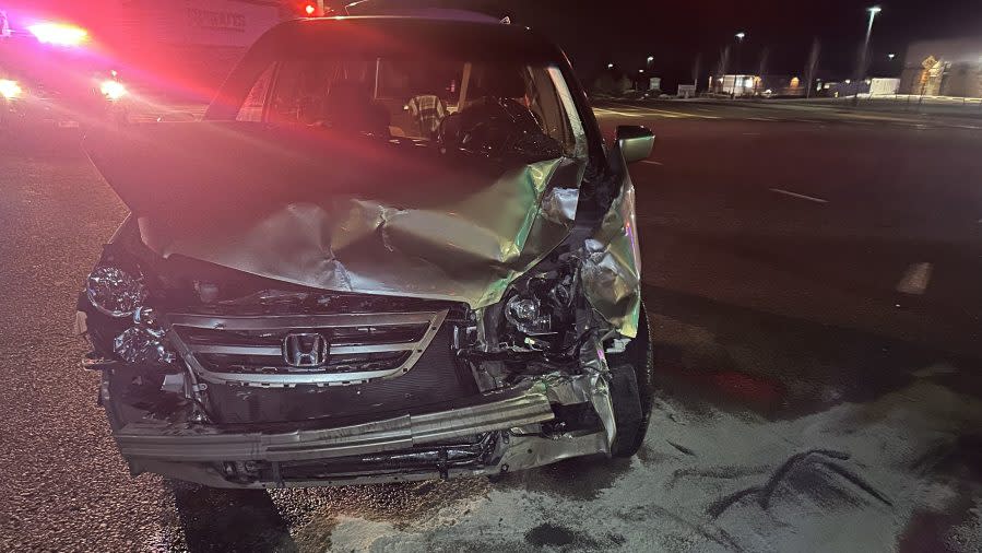 A tan Honda Odyssey with heavy front end damage after the allegedly drink driver crashed into another vehicle