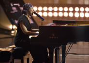 FILE - In this Thursday, March 14, 2019, file photo, Alicia Keys performs "Raise A Man," at the iHeartRadio Music Awards at the Microsoft Theater in Los Angeles. Keys sang softly from the piano, from her home, Sunday, March 29, 2020, to kick off the hour-long “living room" benefit concert put on to raise money during the coronavirus crisis. (Photo by Chris Pizzello/Invision/AP, File)