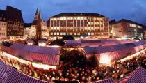 NUREMBERG, GERMANY - NOVEMBER 30: Visitors attend the opening ceremony of the traditional Christmas market 'Nuernberger Christkindlesmarkt' on November 30, 2012 in Nuremberg, Germany. Originating in the 16th century the Nuremberg Christmas market is seen as one of the oldest of its kind in Germany. (Photo by Johannes Simon/Getty Images)