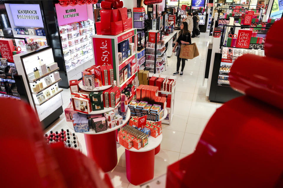 Customers shop in a nearly-empty Macy's early on Black Friday, Nov. 25, 2022, in New York. (AP Photo/Julia Nikhinson)