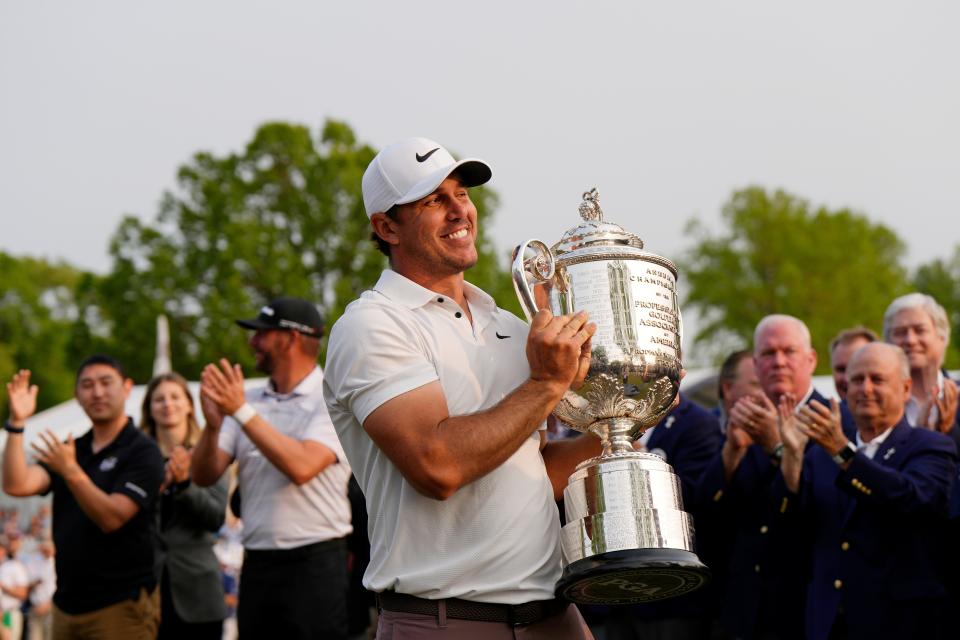Brooks Koepka celebrates after winning the PGA Championship at Oak Hill Country Club.