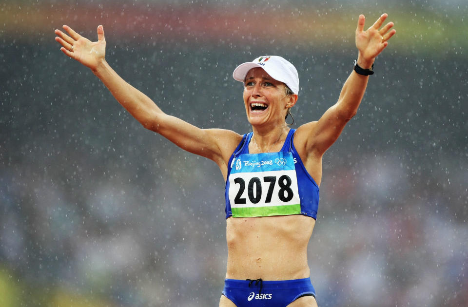 BEIJING - AUGUST 21: Elisa Rigaudo of Italy celebrates third place in the Women's 20km Walk Final and the bronze medal held at the National Stadium during Day 13 of the Beijing 2008 Olympic Games on August 21, 2008 in Beijing, China. (Photo by Jed Jacobsohn/Getty Images)