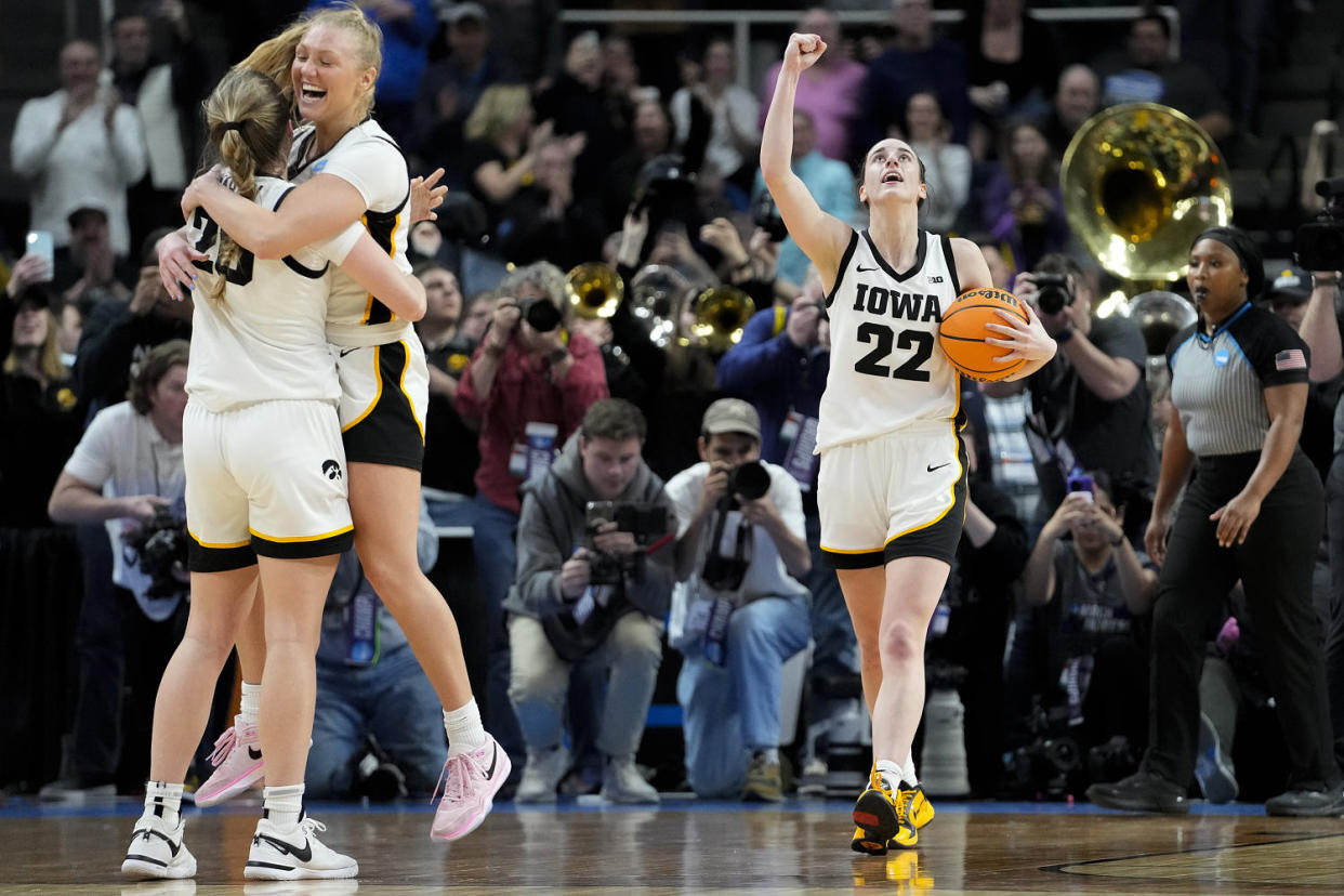 From left, Iowa's Kate Martin, Sydney Affolter and Caitlin Clark celebrate after defeating LSU Monday, April 1, 2024. (Mary Altaffer / AP)