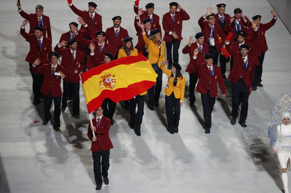 Spain's flag-bearer Javier Fernandez leads his country's contingent during the opening ceremony of the 2014 Sochi Winter Olympics, February 7, 2014. REUTERS/Lucy Nicholson (RUSSIA - Tags: OLYMPICS SPORT)