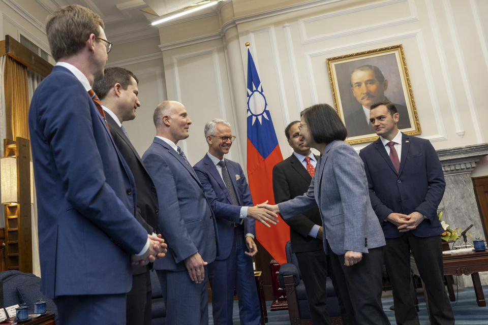 FILE - In this photo released by the Taiwan Presidential Office, then Taiwan's President Tsai Ing-wen, second right, shakes hands with members of United States Congressmen as Rep. Mike Gallagher, the Republican chair of the House Select Committee on the Chinese Communist Party, right, looks on during a meeting in Taipei, Taiwan on Feb. 22, 2024. China on Tuesday, May 21, 2024, sanctioned Mike Gallagher, a former Republican member of Congress from Wisconsin who has shown support for Taiwan. Gallagher will be banned from entering China, any assets he holds in the country will be frozen and he will be barred from various exchanges with Chinese organizations and individuals, the country's Foreign Ministry announced. (Taiwan Presidential Office via AP, File)