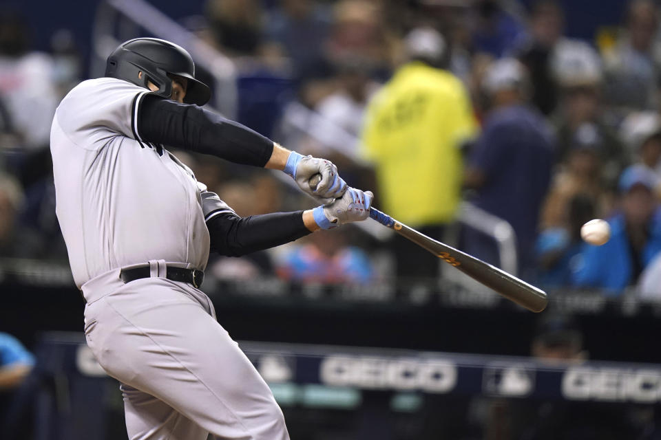 New York Yankees' Anthony Rizzo hits a solo home run during the sixth inning of the team's baseball game against the Miami Marlins, Friday, July 30, 2021, in Miami. (AP Photo/Lynne Sladky)