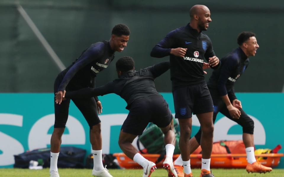 Fabian Delph (R) enjoys himself during England training this week - REUTERS