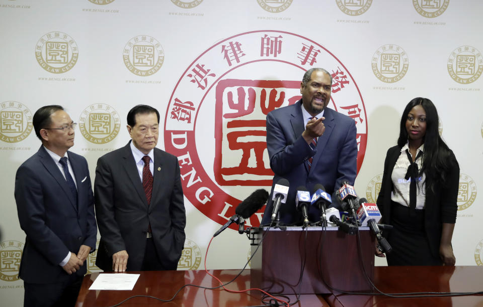 From left, attorney Daniel Deng, forensic scientist Henry Lee, attorney Brian Dunn, and Mary Essuman hold a joint news conference regarding the fatal police shooting of Chinese immigrant Li Xi Wang Wednesday, Aug. 28, 2019, in Rosemead, Calif. Lawyers are pursuing claims against the city of Chino, Calif., for the fatal shooting of an unarmed man by a police officer who was part of team serving a search warrant on a suspected illegal marijuana operation. (AP Photo/Marcio Jose Sanchez)