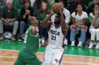 Philadelphia 76ers center Joel Embiid (21) shoots at the basket as Boston Celtics center Al Horford (42) defends during the first half of Game 7 in the NBA basketball Eastern Conference semifinal playoff series, Sunday, May 14, 2023, in Boston. (AP Photo/Steven Senne)