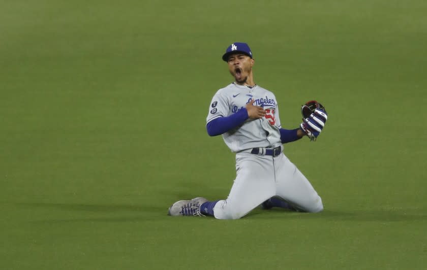 Los Angeles Dodgers' Mookie Betts celebrates after making a diving catch