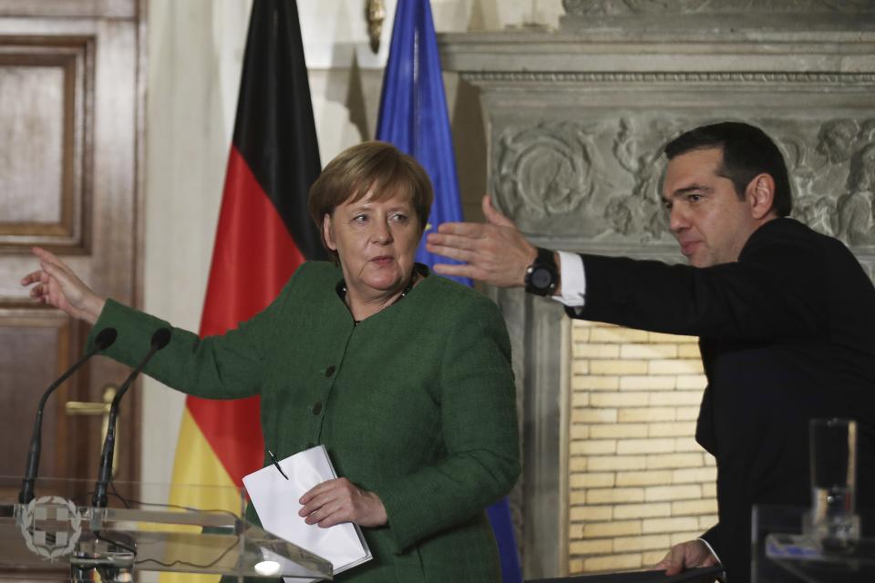 FILE - German Chancellor Angela Merkel, left, and Alexis Tsipras talk to the media during a press conference after their meeting in Athens, Greece, Jan. 10, 2019. Greece's left-wing opposition leader, Alexis Tsipras has announced his decision to step down after a crushing election defeat. Tsipras made the announcement on Thursday, June 29, 2023. The 48 year-old politician served as Greece's prime minister from 2015 to 2019 during politically tumultuous years as the country struggled to remain in the euro zone and end a series of international bailouts. (AP Photo/Petros Giannakouris, File)