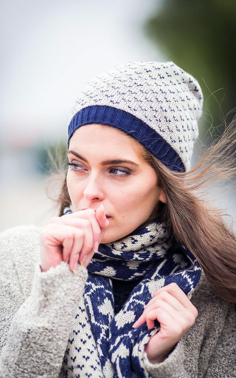 Woman with a hat and scarf on - Credit: Alamy