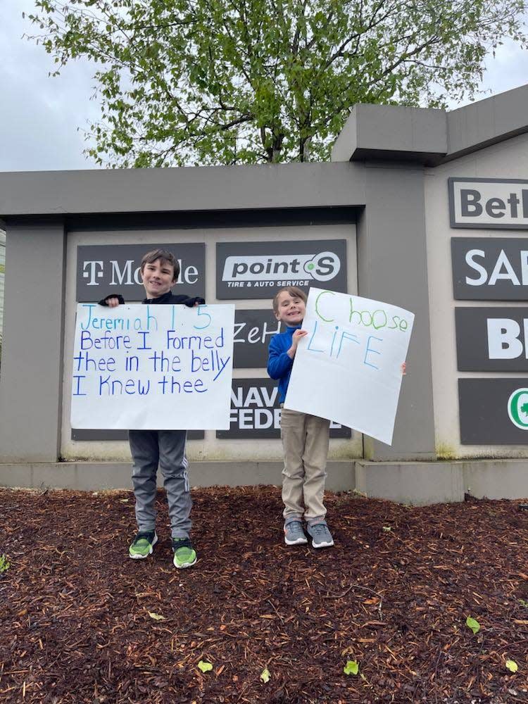 Jacob Ganavage, 9, and Joshua English, 7, stand at Bethel and Lund avenues in Port Orchard on Thursday afternoon expressing support for the U.S. Supreme Court overturning Roe v. Wade, which would pave the way for states to limit access to abortion in the U.S.