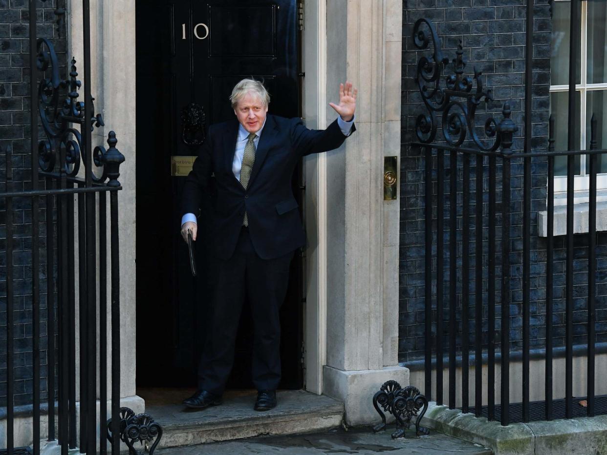 Johnson leaves No 10 to deliver a post-victory speech yesterday: EPA