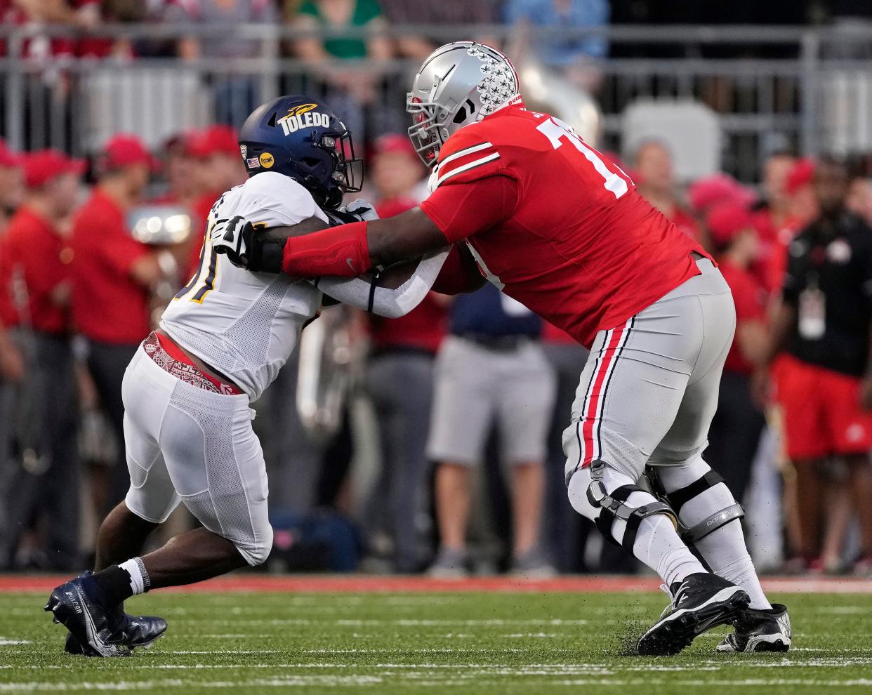 Sep 17, 2022; Columbus, Ohio, USA; Ohio State Buckeyes offensive lineman Dawand Jones (79) blocks Toledo Rockets wide receiver Dalen Stovall (81) during Saturday's NCAA Division I football game at Ohio Stadium. Mandatory Credit: Barbara Perenic/Columbus Dispatch