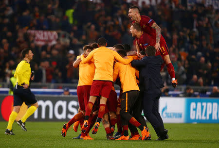 Soccer Football - Champions League Quarter Final Second Leg - AS Roma vs FC Barcelona - Stadio Olimpico, Rome, Italy - April 10, 2018. Roma's Aleksandar Kolarov and team mates celebrate at the end of the match. REUTERS/Tony Gentile