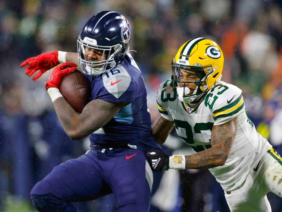 Treylon Burks fights through a defender against the Green Bay Packers.