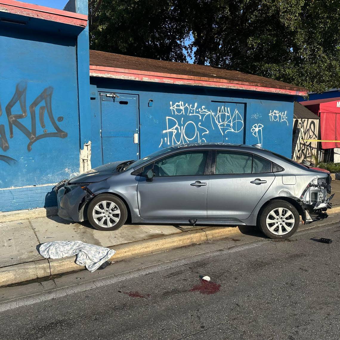 A woman standing on a sidewalk was critically injured when an 18-wheeler smacked a car from behind, causing the smaller vehicle to jump the curb and hit her near the Northwest 27th drawbridge in Miami on Wednesday, March 24, 2024, police said.