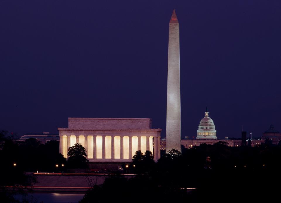 This photograph by Carol M. Highsmith shows the Lincoln Memorial in Washington, D.C., illuminated at dusk. Beside it can be seen the towering Washington Monument and the U.S. Capitol in the distance.