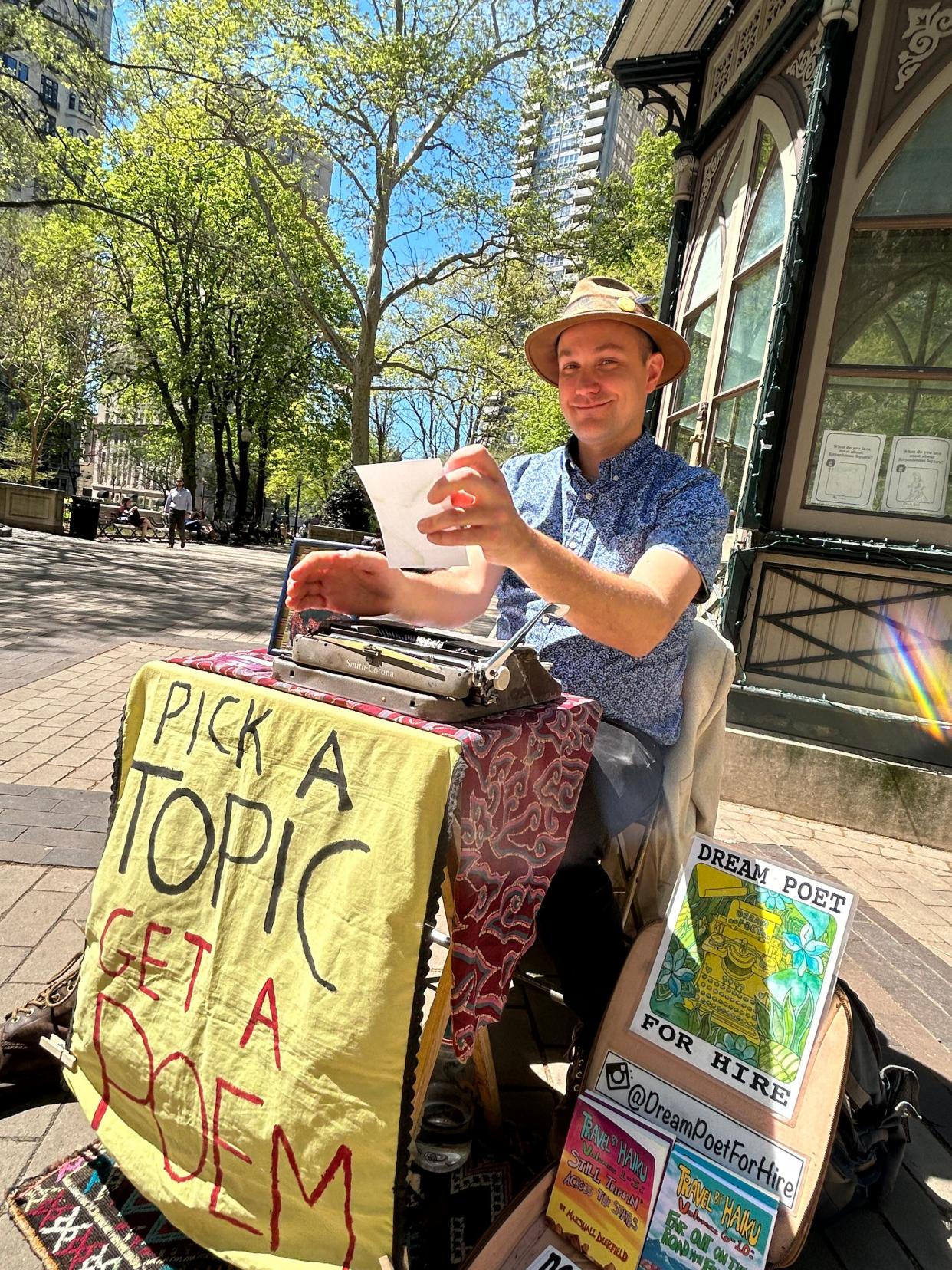 Marshall Kavanaugh sets up his table in Philadelphia's Rittenhouse Square and prepares to write poetry on demand for anyone who asks.