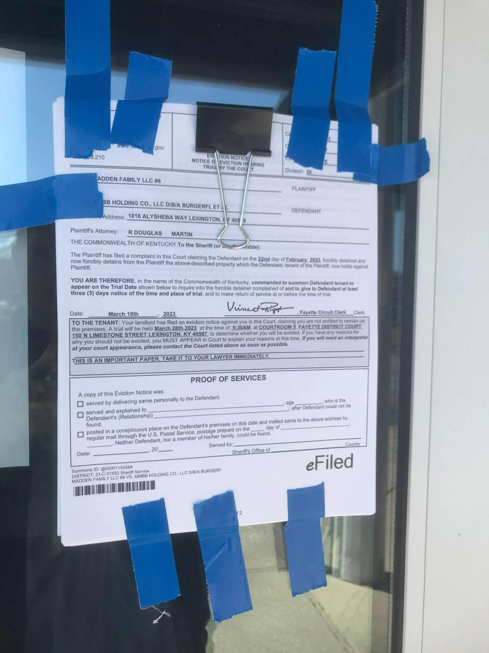 A copy of the notice of eviction and the complaint from the landlord was taped to the door of BurgerFi in Hamburg.