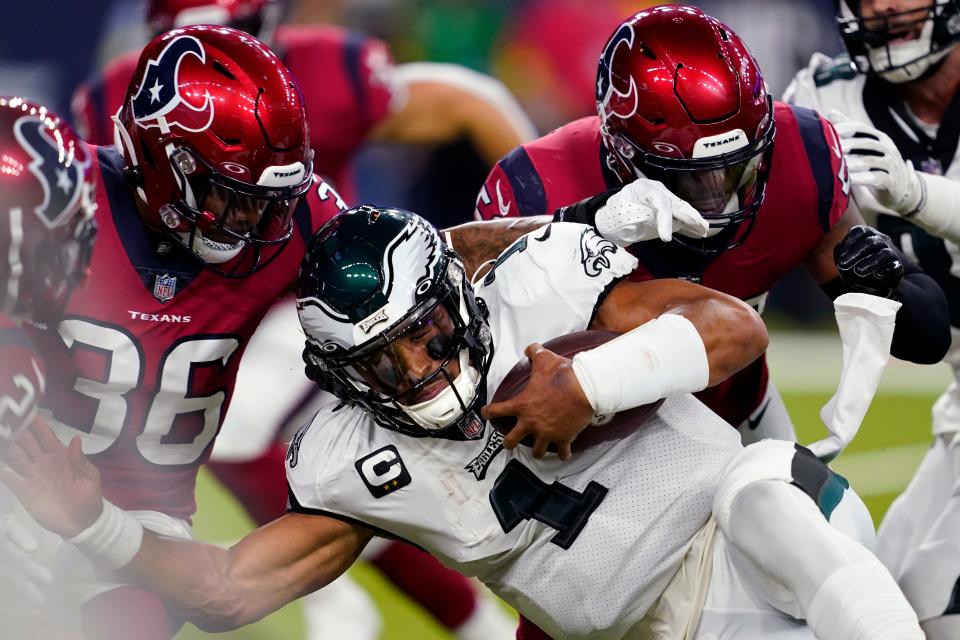 Philadelphia Eagles quarterback Jalen Hurts (1) carries against Houston Texans safety Jonathan Owens (36) in the first half of an NFL football game in Houston, Thursday, Nov. 3, 2022.