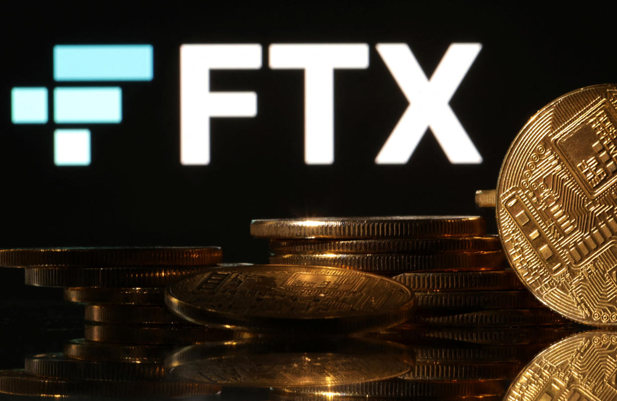 Representations of cryptocurrencies are seen in front of displayed FTX logo in this illustration taken November 10, 2022. REUTERS/Dado Ruvic/Illustration