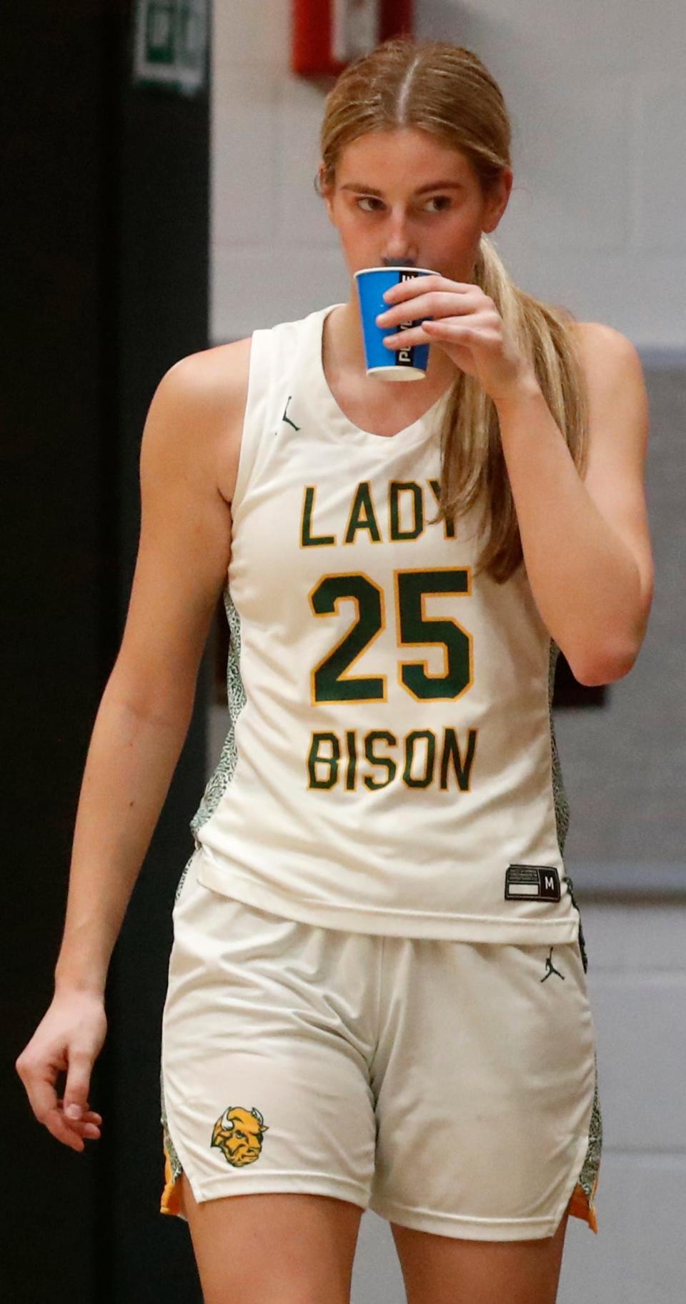 Benton Central Bison center Sarah Gick (25) takes a drink after being subbed off during the IHSAA girl’s basketball game against the Harrison Raiders, Friday, Jan. 26, 2024, at Benton Central High School in Oxford, Ind. Benton Central won 59-31.